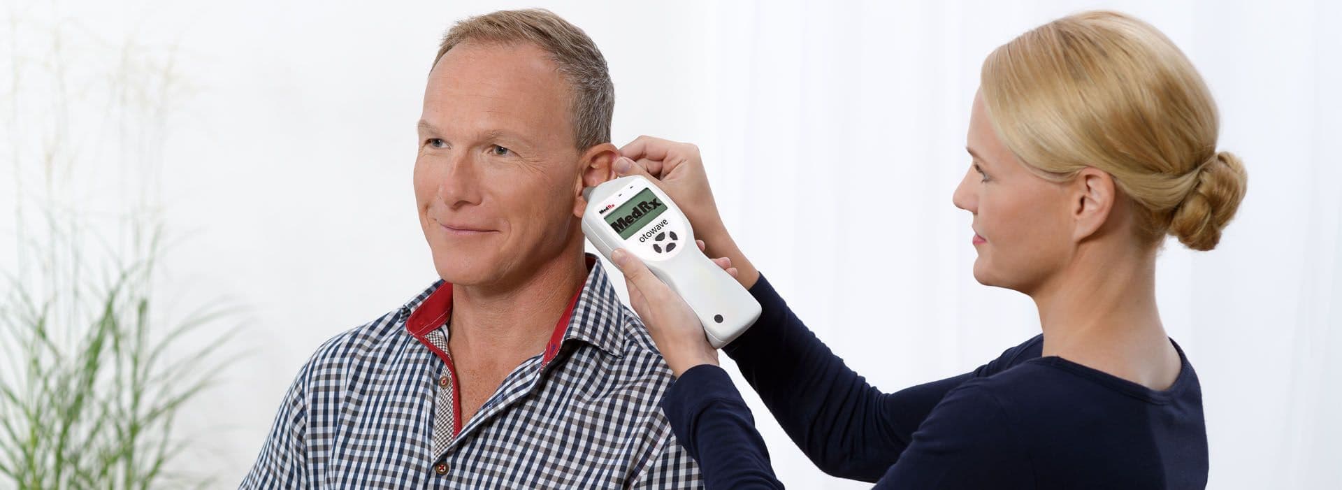 Tympanometry test being performed with a MedRx Otowave 102-4 device.
